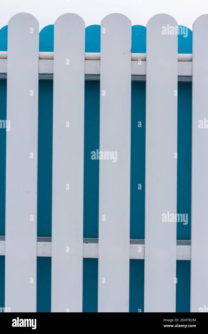 White and blue picket fence with sky background Stock Photo - Alamy
