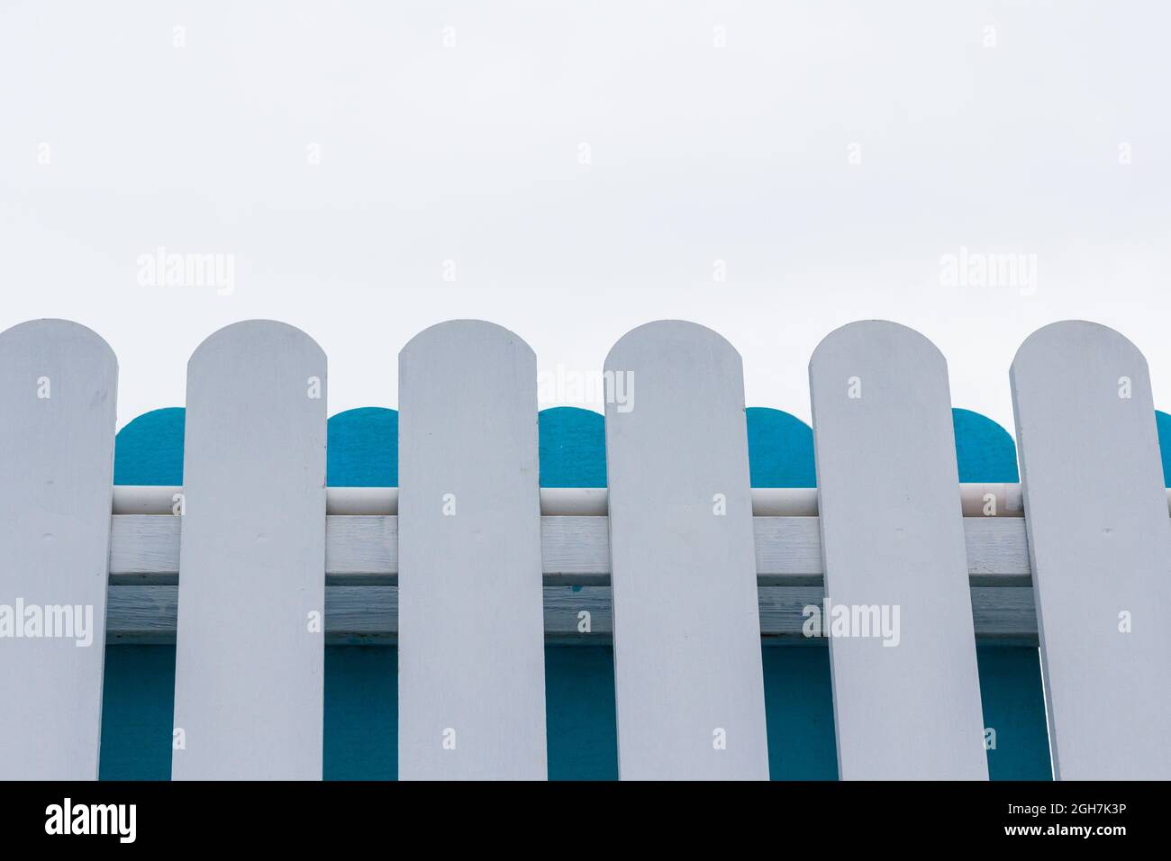 White and blue picket fence with sky background Stock Photo - Alamy
