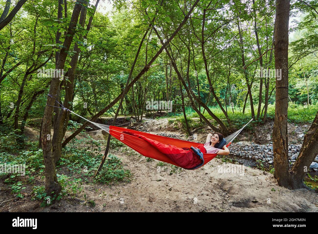 Woman alone relaxing in hammock hi-res stock photography and images - Alamy