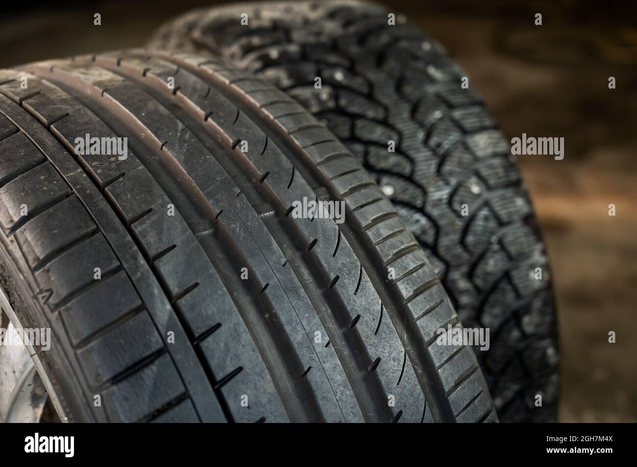 Winter studded and summer car tires. Change of wheels according to the