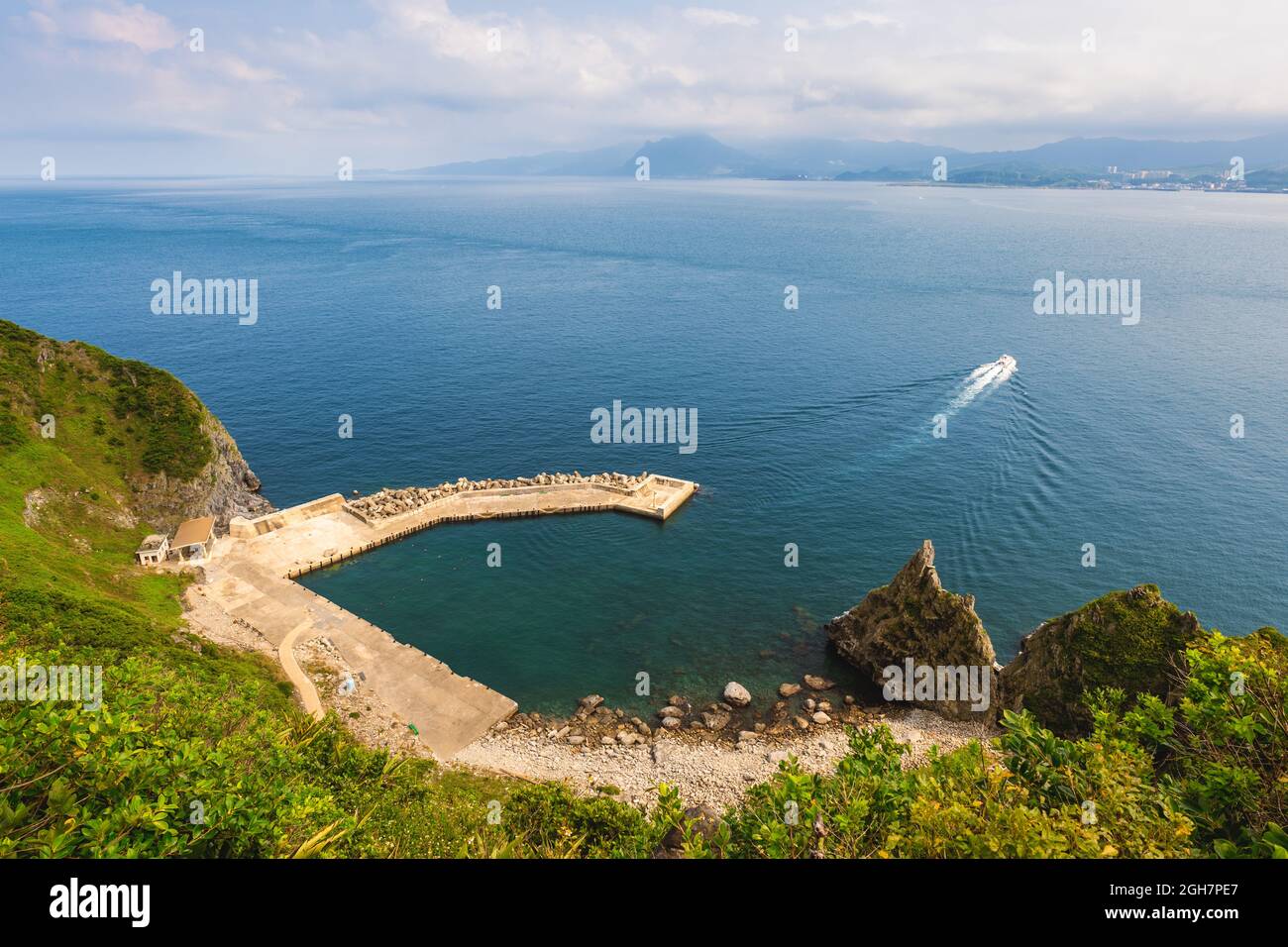 ferry leaving the pier at keelung islet at north taiwan Stock Photo