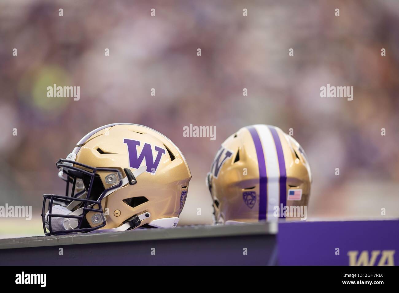 Washington Huskies helmets along the sideline during the first quarter of an NCAA college football game against the Montana Grizzlies, Saturday Septem Stock Photo