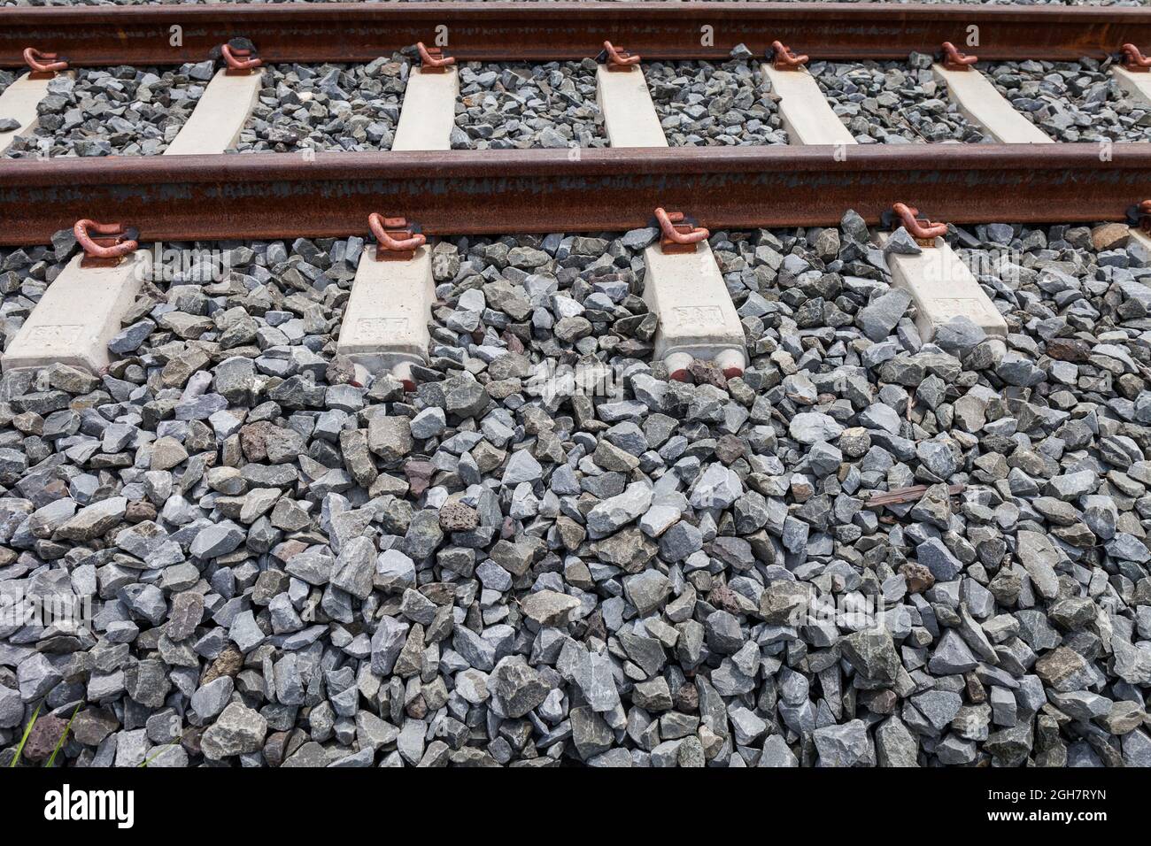 railroad tracks with rust on rock background Stock Photo Alamy
