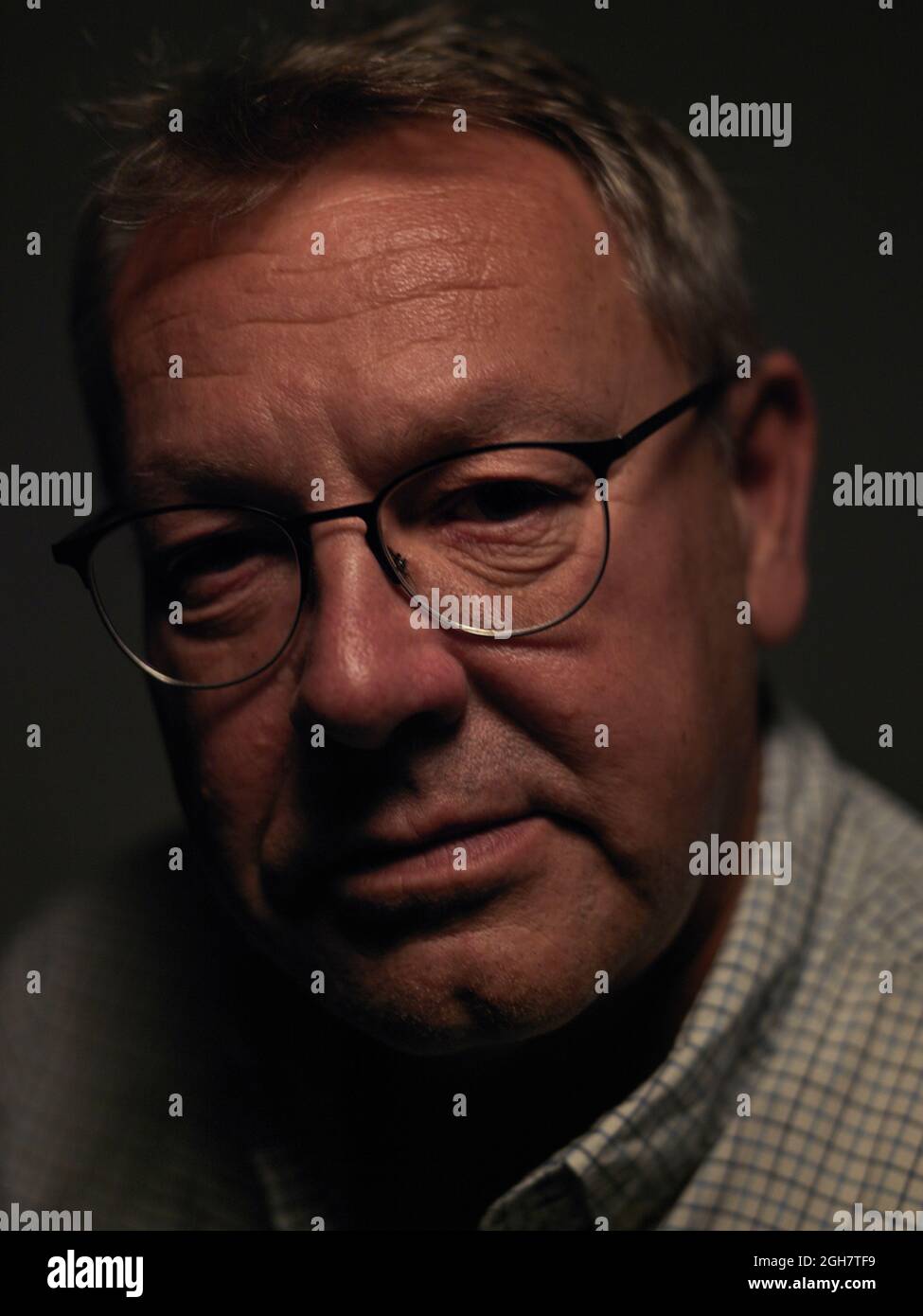 head and shoulder portrait of middle aged man wearing glasses Stock Photo