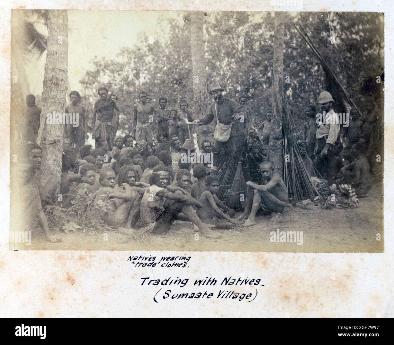 Europeans trading with the natives of Sumaate Village in Papua New Guinea during the G.S.A. (Geographical Society of Australasia) New Guinea Exploring Expedition 1885 Stock Photo