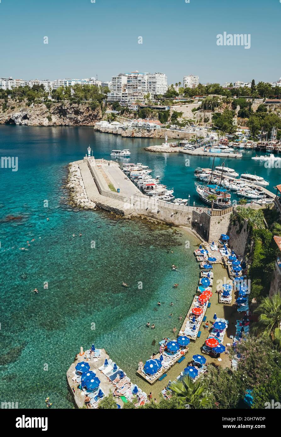 Antalya, Turkey - 30 July 2021: Mermerli beach in Antalya Turkey. Wonderful summer sunny turquoise beach on the Mediterranean coast. Rest, tourism and travel concept. . High quality photo Stock Photo