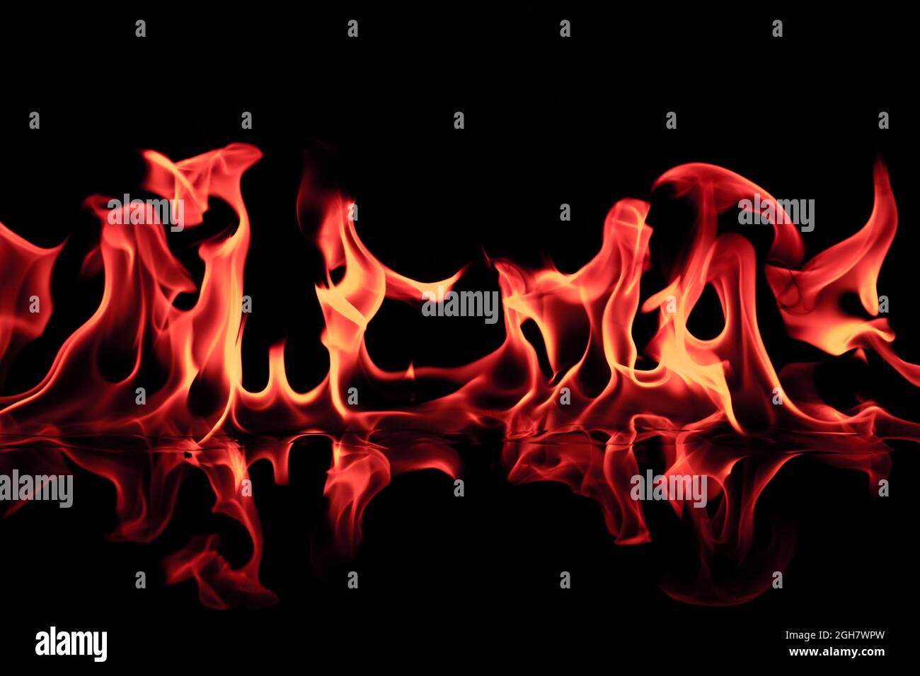fire flames reflected in black background Stock Photo - Alamy
