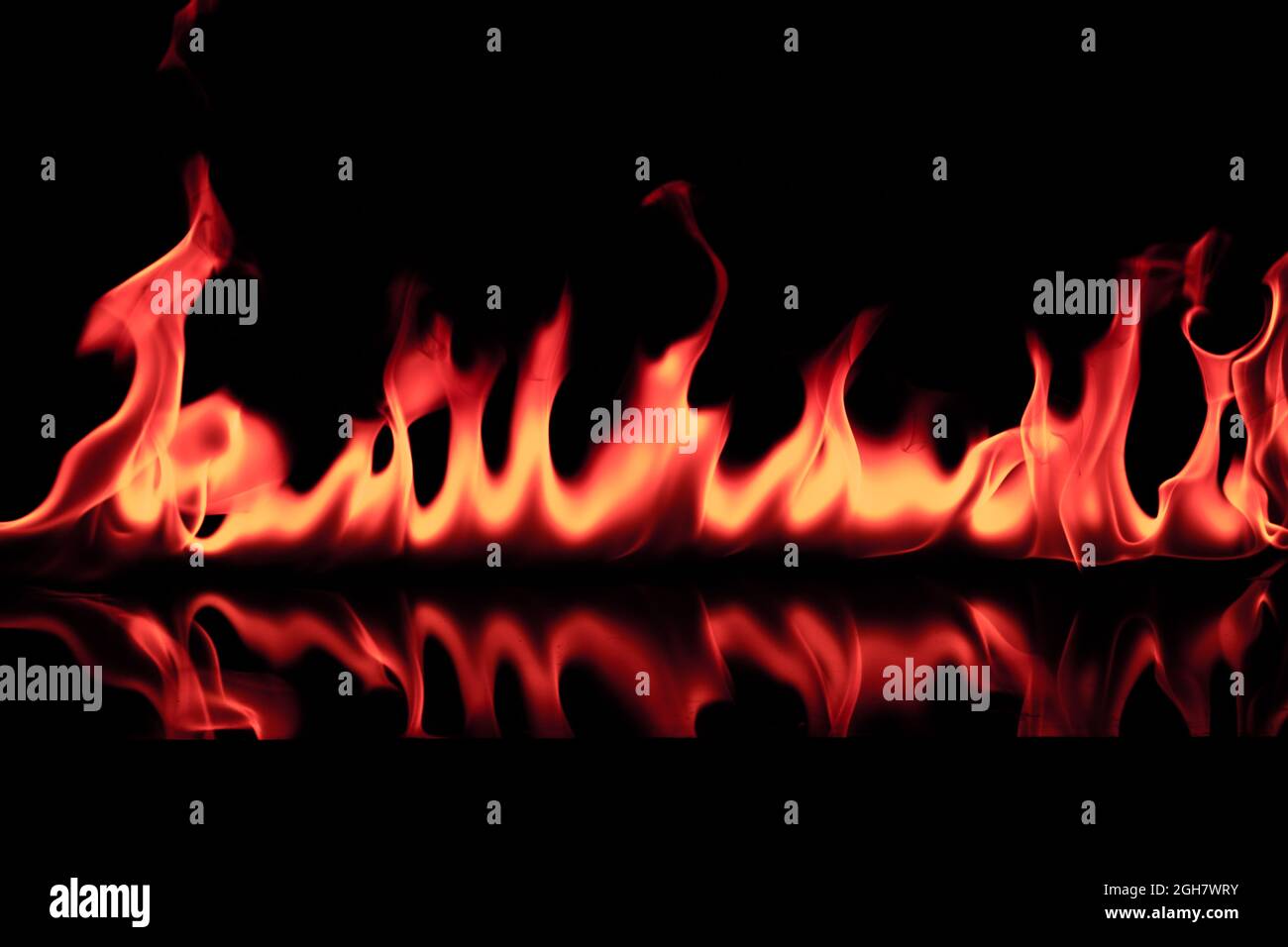 fire flames reflected in black background Stock Photo - Alamy