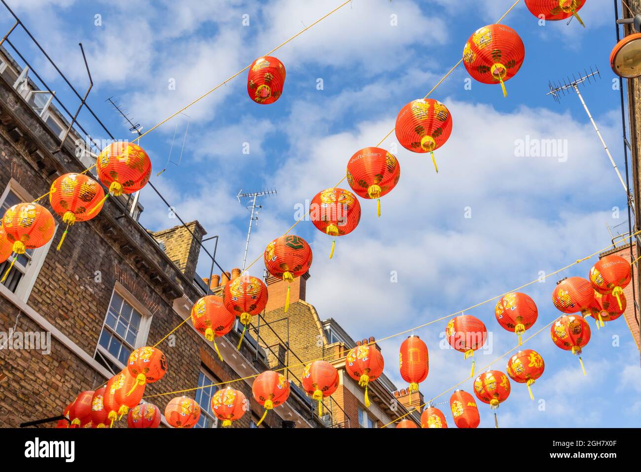 Colourful red and gold Chinese lanterns strung across Lisle Street in