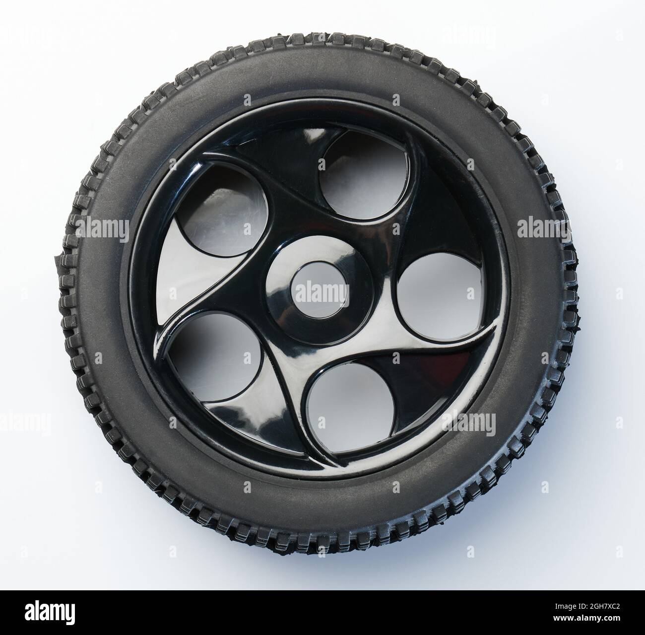 One black rc car wheel with plastic rim isolated on white studio ...