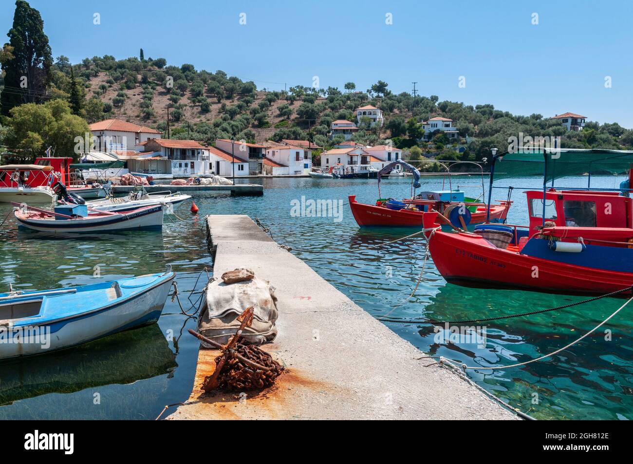 The little harbour at Paleo Trkeri on the island of Palio Trikeri on the southern coast of the Pelion Peninsula, Greece Stock Photo