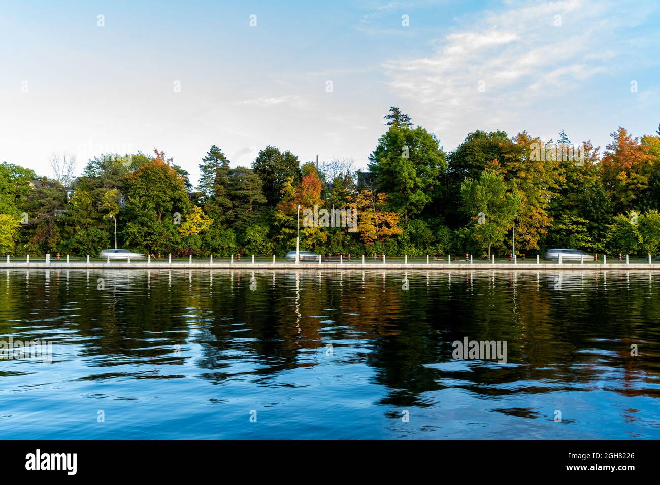 View of a beautiful park with a lake and autumn trees Stock Photo - Alamy