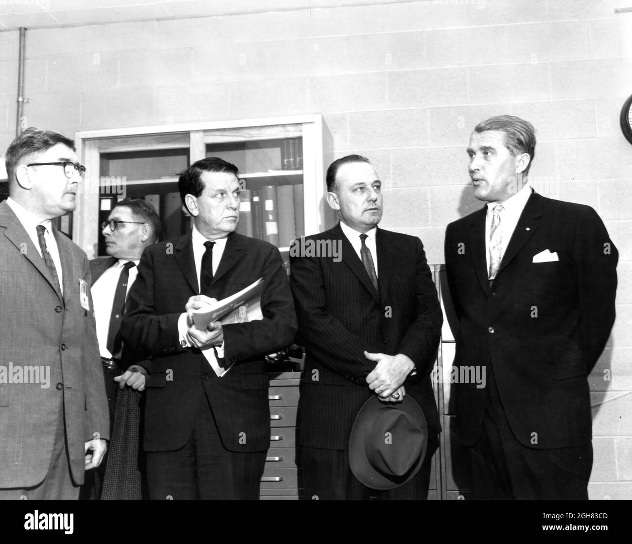 THE MEMBERS OF THE HOUSE COMMITTEE ON SCIENCE AND ASTRONAUTICS VISITED THE MARSHALL SPACE FLIGHT CENTER (MSFC) ON MARCH 9, 1962 TO GATHER FIRSTHAND INFORMATION OF THE NATION'S SPACE EXPLORATION PROGRAM.  THE CONGRESSIONAL GROUP WAS COMPOSED OF MEMBERS OF THE SUBCOMMITTEE ON MANNED SPACE FLIGHT.  THE SUBCOMMITTEE WAS BRIEFED ON MSFC'S MANNED SPACE EFFORTS EARLIER IN THE DAY AND THEN INSPECTED MOCKUJPS OF THE SATURN I WORKSHOP AND THED APOLLO TELESCOPE MOUNT,  TWO ROJECTS DEVELOPED BY MSFC FOR THE POST-APOLLO PROGRAM.  IN THIS PHOTOGRAPH, MSFC DIRECTOR, DR. WERNHER VON BRAUN (FAR RIGHT)  IS HAVI Stock Photo