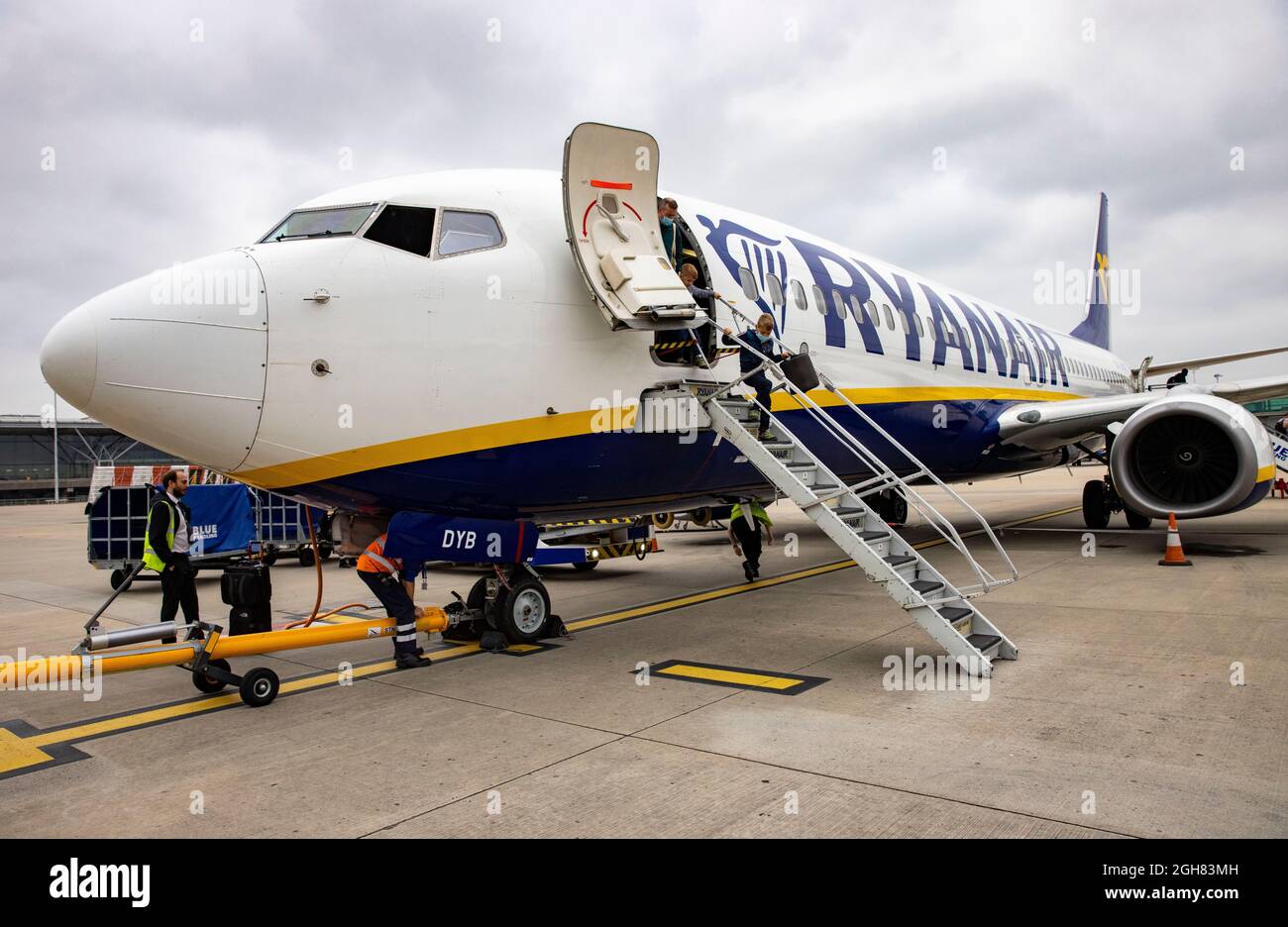 A Boeing 737-800 on the tarmac at Stansted airport arriving from Venice. Passengers disembark enter arrivals. Italy is on the Amber list of countries. Stock Photo
