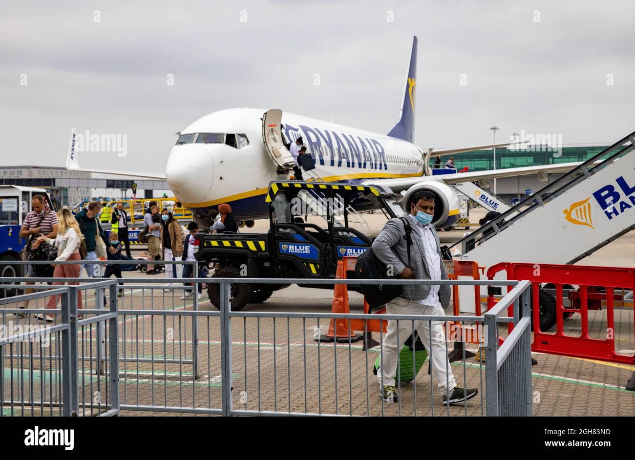 A Boeing 737-800 on the tarmac at Stansted airport arriving from Venice. Passengers disembark enter arrivals. Italy is on the Amber list of countries. Stock Photo