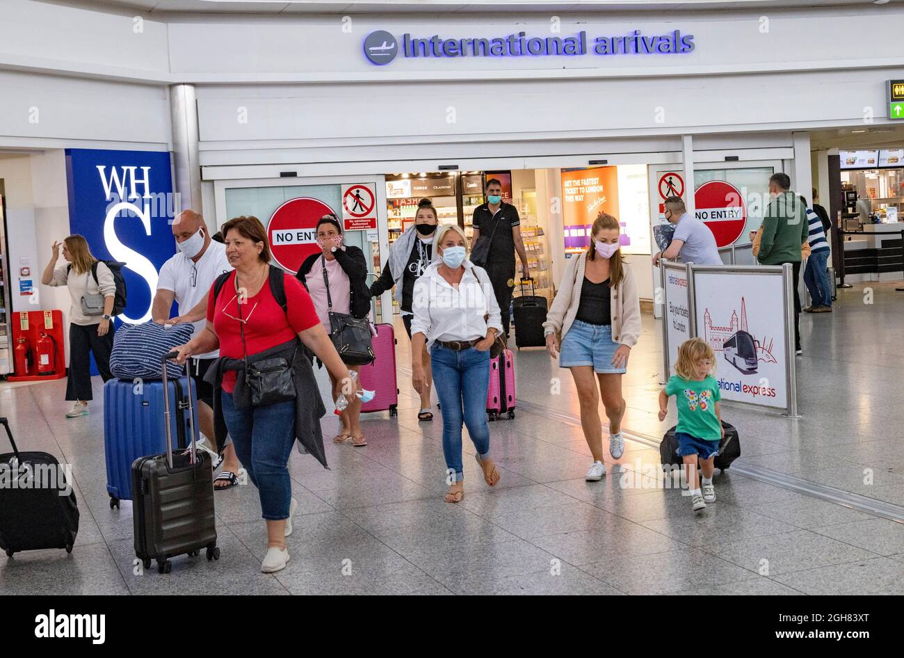 International arrivals from Italy at Stansted airport. Passengers arriving from Amber list countries must provide a test and a Passenger Locator Form Stock Photo