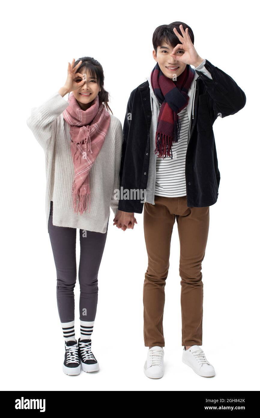 Happy young couple holding hands Stock Photo - Alamy