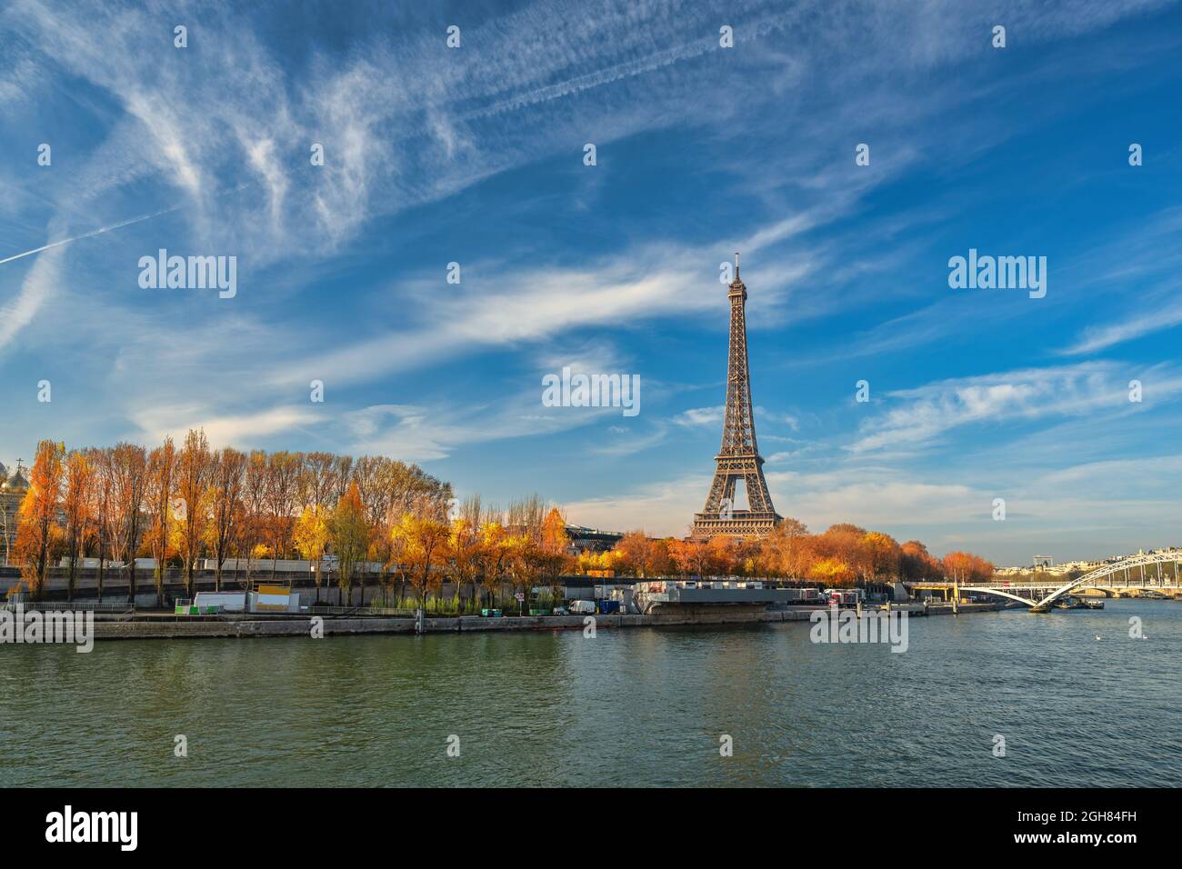 Paris France, city skyline at Eiffel Tower and Seine River Debilly Footbridge with autumn foliage season Stock Photo