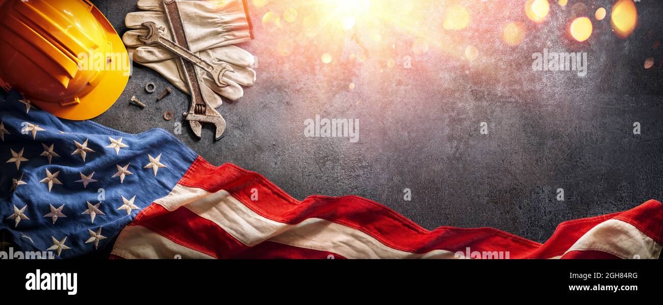 Labor Day - National Holiday - Helmet And Tools With American Flag Stock Photo