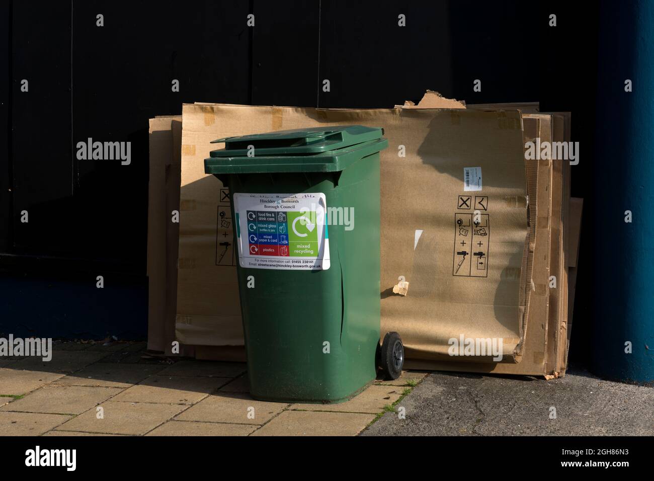 Mixed recycling bin and sheets of cardboard for recycling, Hinckley,  Leicestershire, UK Stock Photo - Alamy