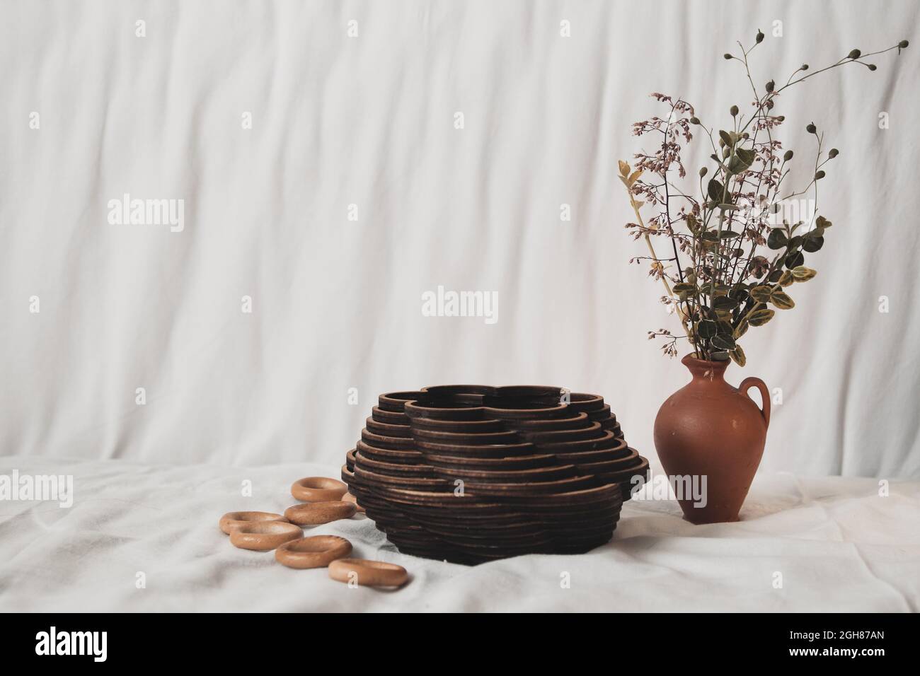 Drying bagels in an authentic carved wooden box on a tablecloth, an authentic lifestyle photo in neutral colors, composition. High quality photo Stock Photo