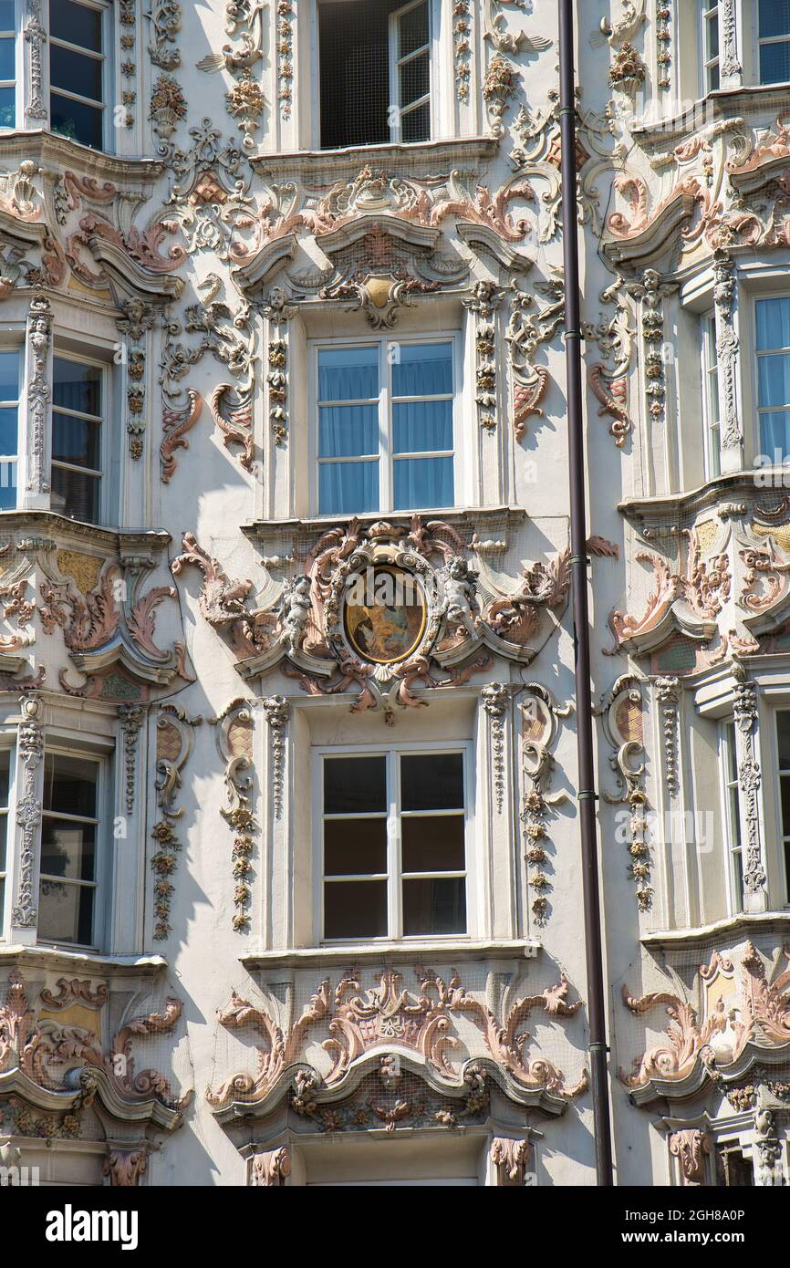 Vertical shot of the Helbling House under the sunlight in Innsbruck, Austria Stock Photo