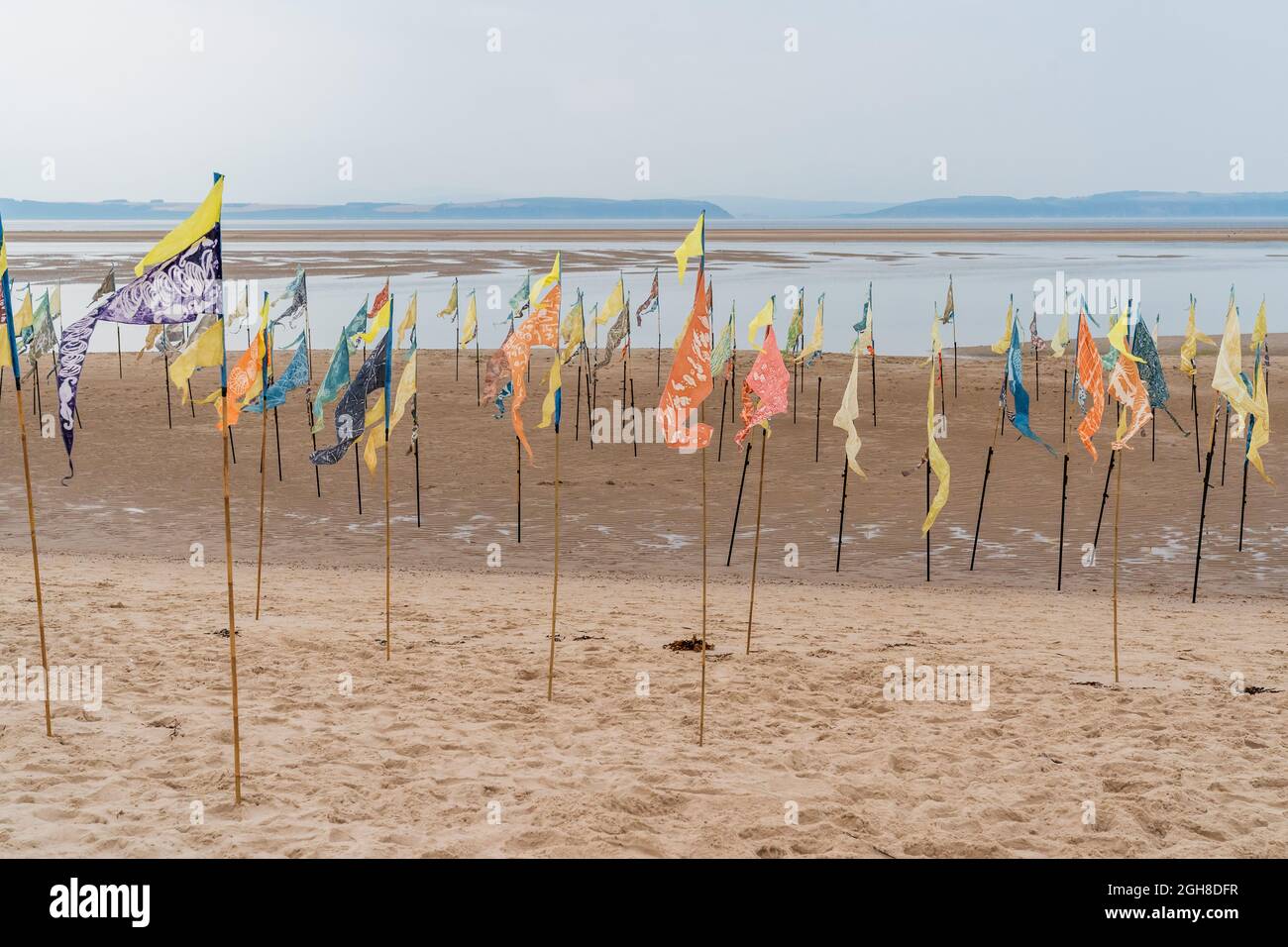 Nairn East Beach, Highlands, Scotland, UK. 5th September, 2021. As part of the Nairn Books and Arts Festival there was a Kinetika Flag Installation. ' A stunning installation of 500 naturally dyed silk flags on Nairn’s East Beach by international outdoor arts company Kinetika. Created by communities along the East coast of the UK as part of the Beach of Dreams project, the flags will be enhanced by flags inspired by Nairn Beach created by members of the local community at workshops led by Ali Pretty, Artistic Director of Kinetika. ' CREDIT - JASPERIMAGE/AlamyLiveNews Stock Photo