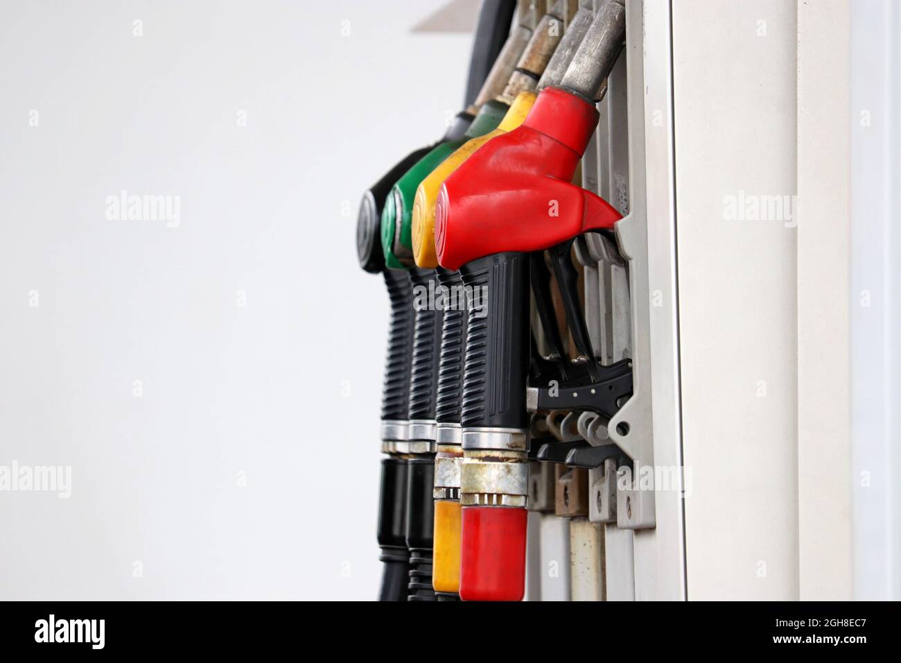 Petrol hoses on filling station in a row. Gas station service Stock Photo