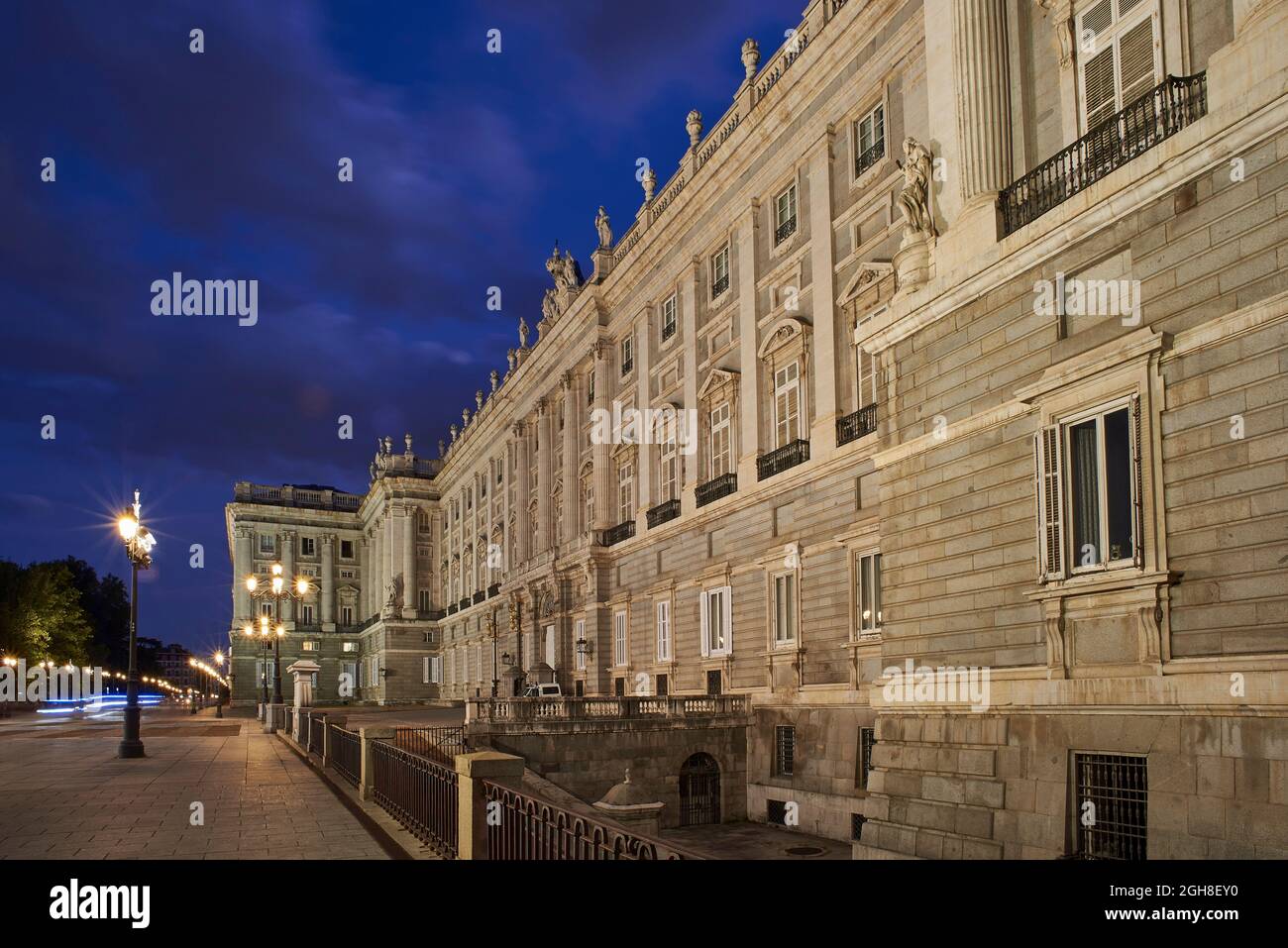 Principal facade of the Royal Palace (Palacio Real) of Madrid at nightfall. View from Plaza de Oriente Square. Madrid, Spain. Stock Photo
