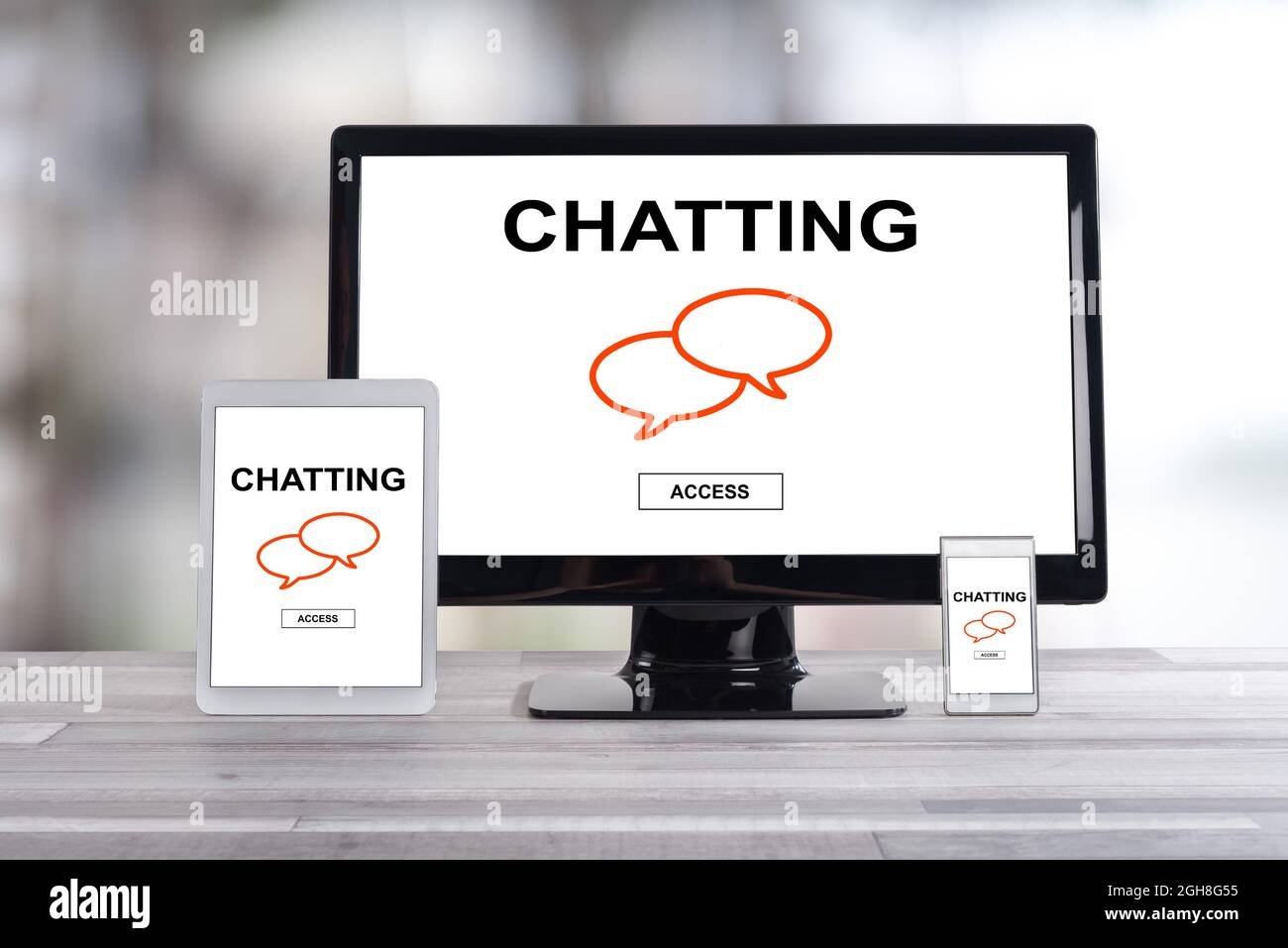 Chatting concept shown on different information technology devices Stock Photo