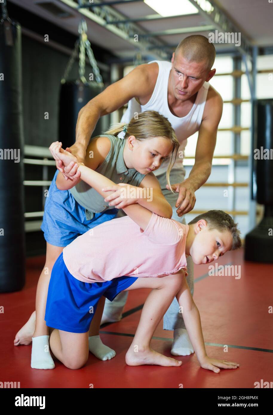 Coach Teaches Children To Apply Self Defense Techniques In The Gym Stock Photo Alamy