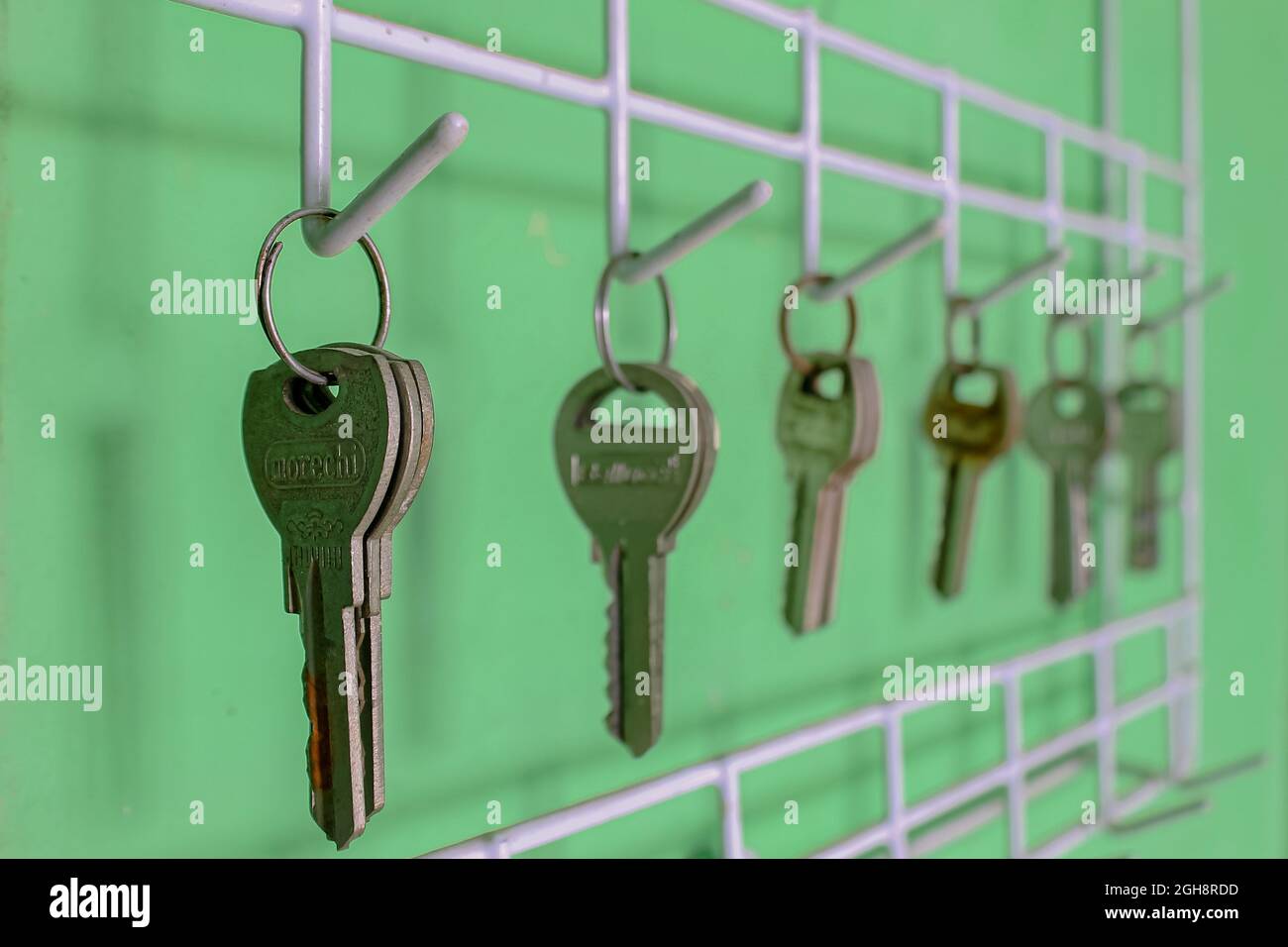 Locks lined up hanging on the wall Stock Photo