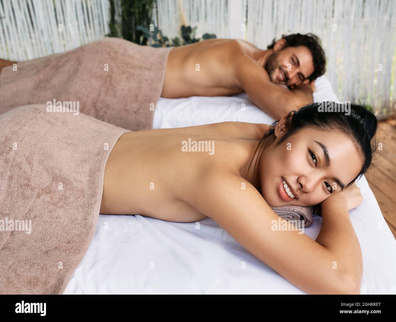 Asian woman with her handsome boyfriend enjoying spa vacation Stock Photo