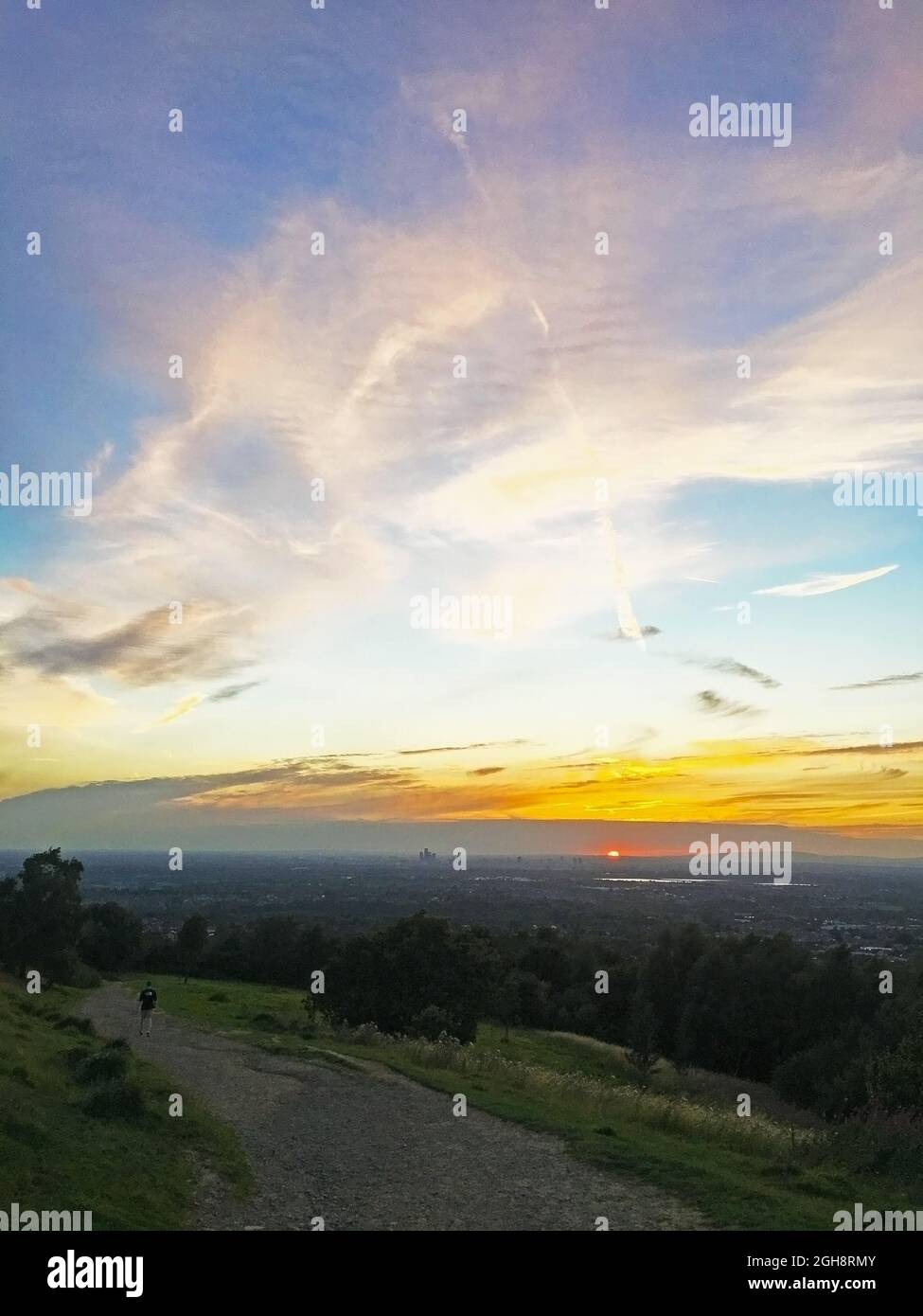 Beautiful sunset from the top of Werneth Low Country Park, with stunning views of Greater Manchester, England Stock Photo