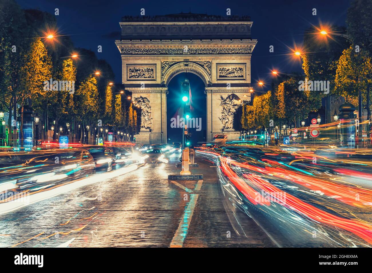 Arc De Triomphe in Paris city by night Stock Photo