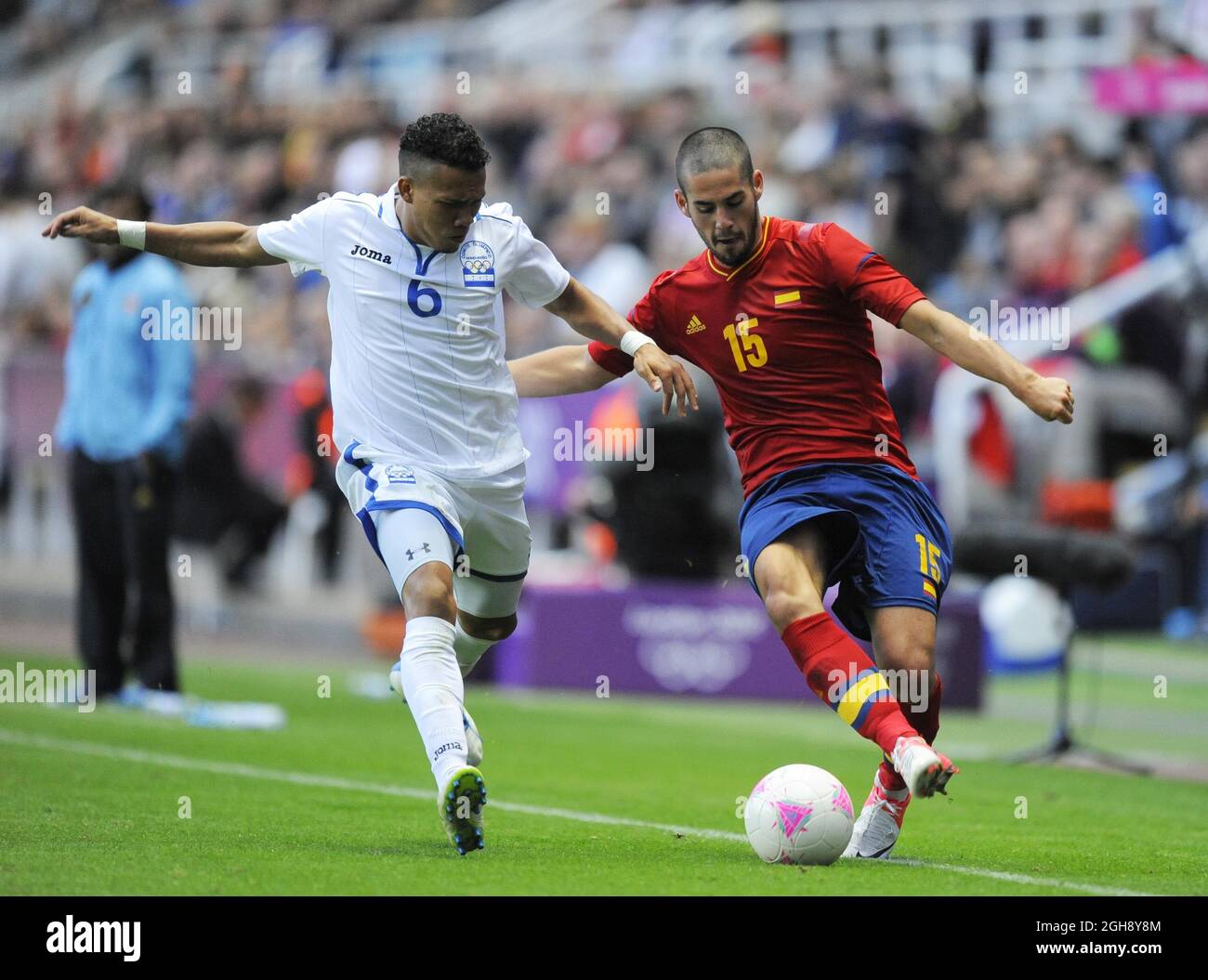 Honduras' Arnold Peralta (L) and Spain's Isco during the London Olympic 2012 first round Group D men's match between Spain v Honduras at the St. James' Park, Newcastle upon Tyne on the 29th July 2012. Stock Photo