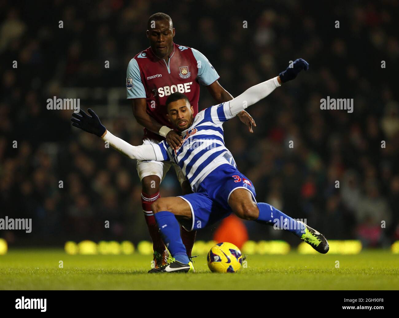 West Ham's Mohamed Diame tussles with QPR's Armand Traore during the Barclays Premier League soccer match between West Ham United and Queens Park Rangers at Upton Park in London, United Kingdom on January 19, 2013. Picture David Klein Stock Photo