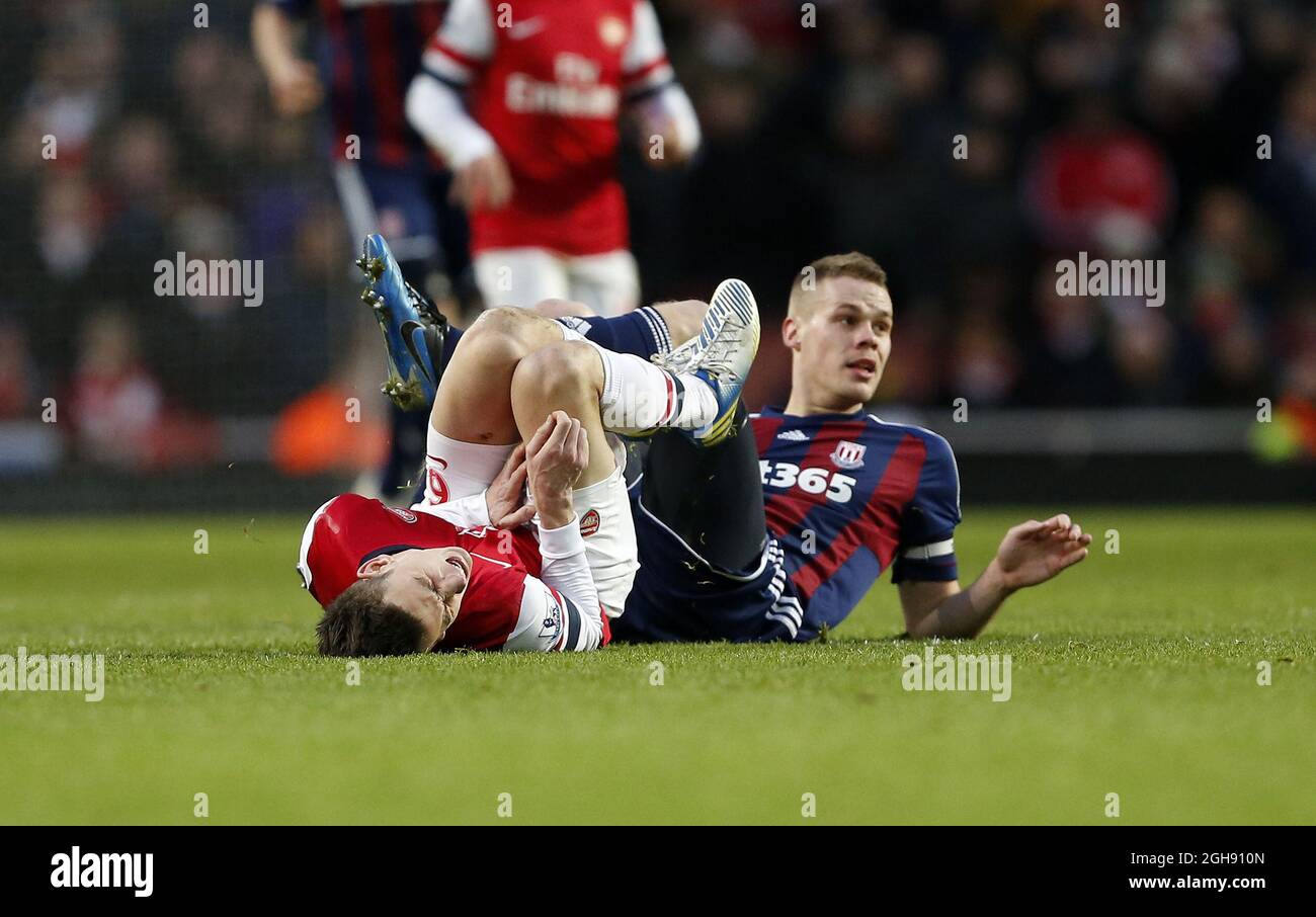 Stoke's Ryan Shawcross gets booked for this tackle on Arsenal's Laurent Koscielny during the Barclays Premier League soccer match between Arsenal and Stoke at the Emirates Stadium in London, United Kingdom on February 02, 2013. Stock Photo