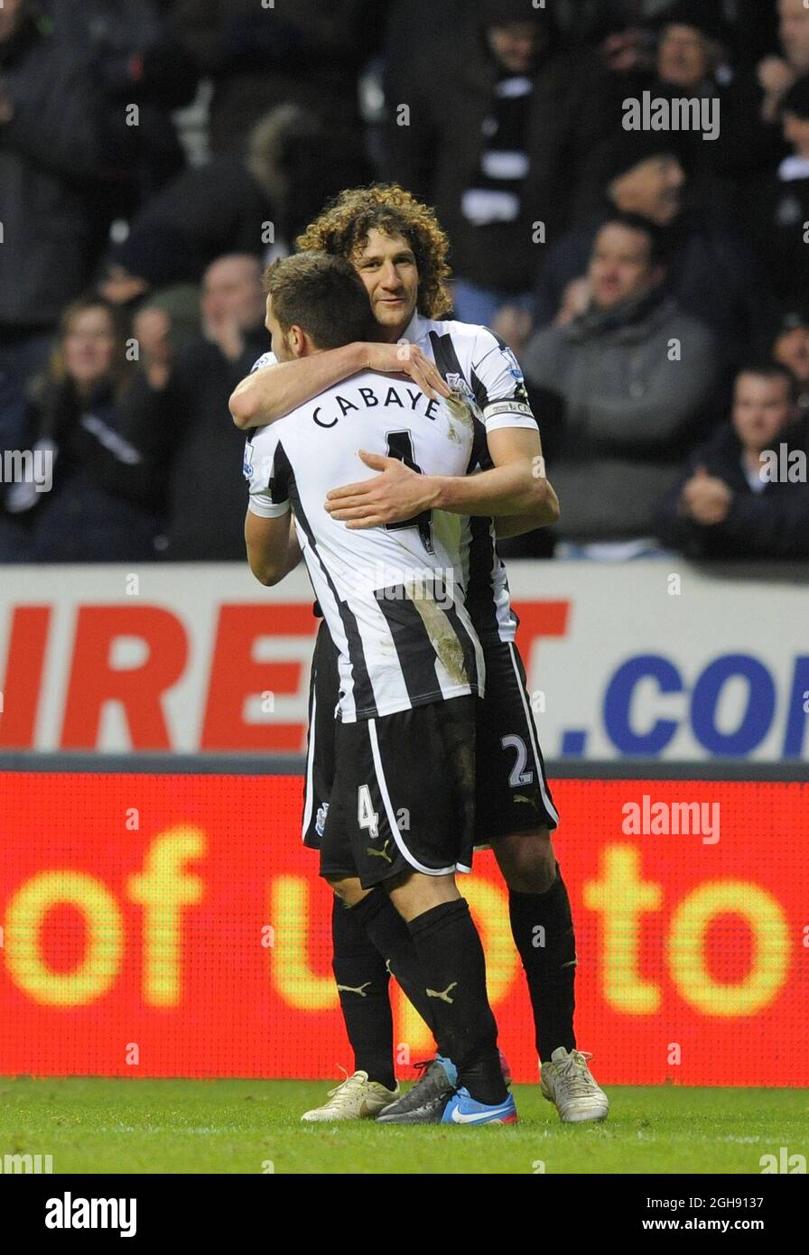 Fabricio Coloccini of Newcastle United (R) celebrates after the final whistle with Yohan Cabaye of Newcastle United during the Barclays Premier League soccer match between Newcastle Utd and Chelsea at St. James' Park in Newcastle, United Kingdom on February 02, 2013. Stock Photo
