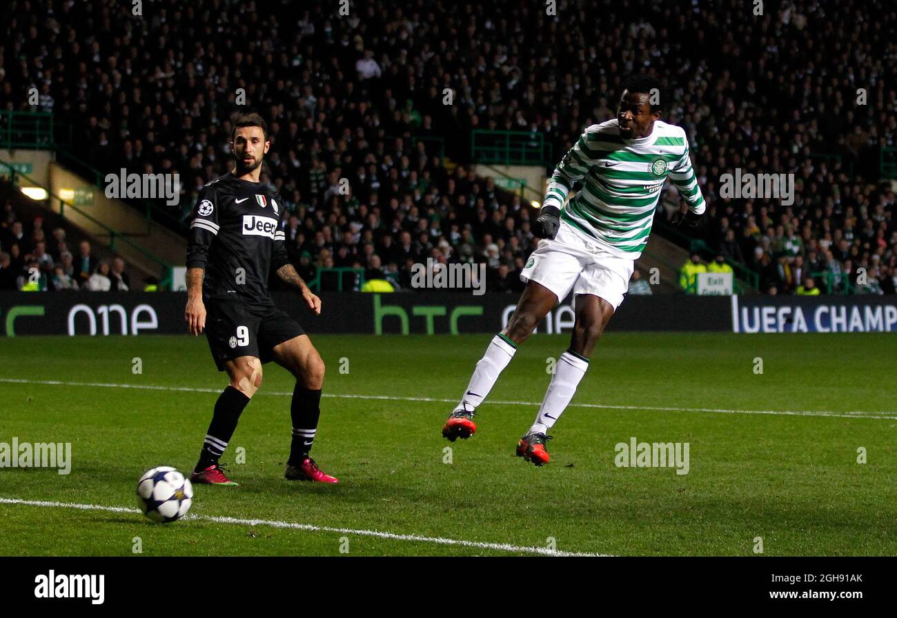 Efe Ambrose (R) of Celtic headers at goal during the UEFA Champions League First Knockout Round of Sixteen, 1st leg match between Celtic and Juventus at the Celtic Park Stadium in Glasgow, Scotland on 12th February 2013 Stock Photo