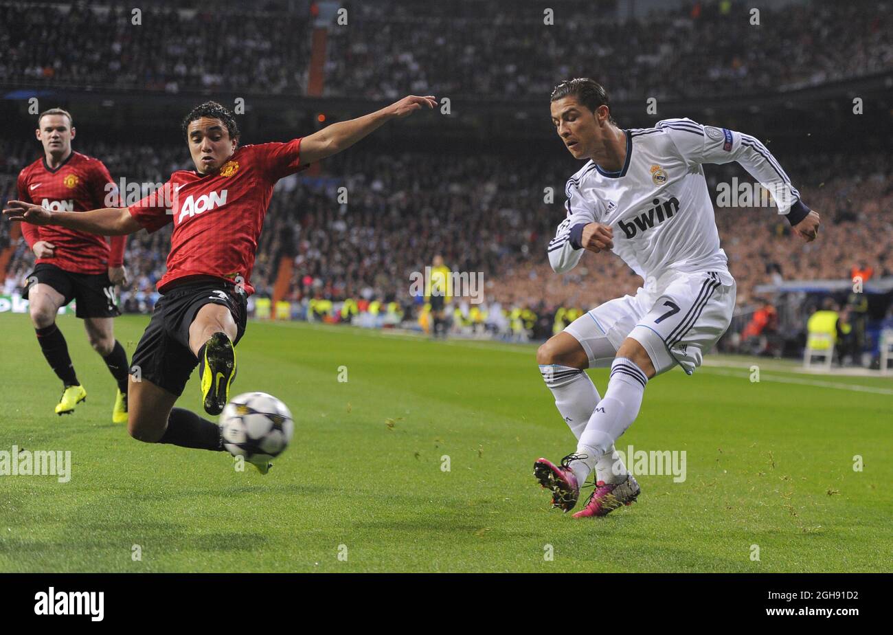 Rafael Pereira da Silva of Manchester United intercepts Cristiano Ronaldo of Real Madrid during the UEFA Champions League First Knockout Round of 16, 1st leg match between Real Madrid and Manchester Utd at Santiago Bernabeu Stadium in Madrid, Spain on 13th February 2013 Stock Photo