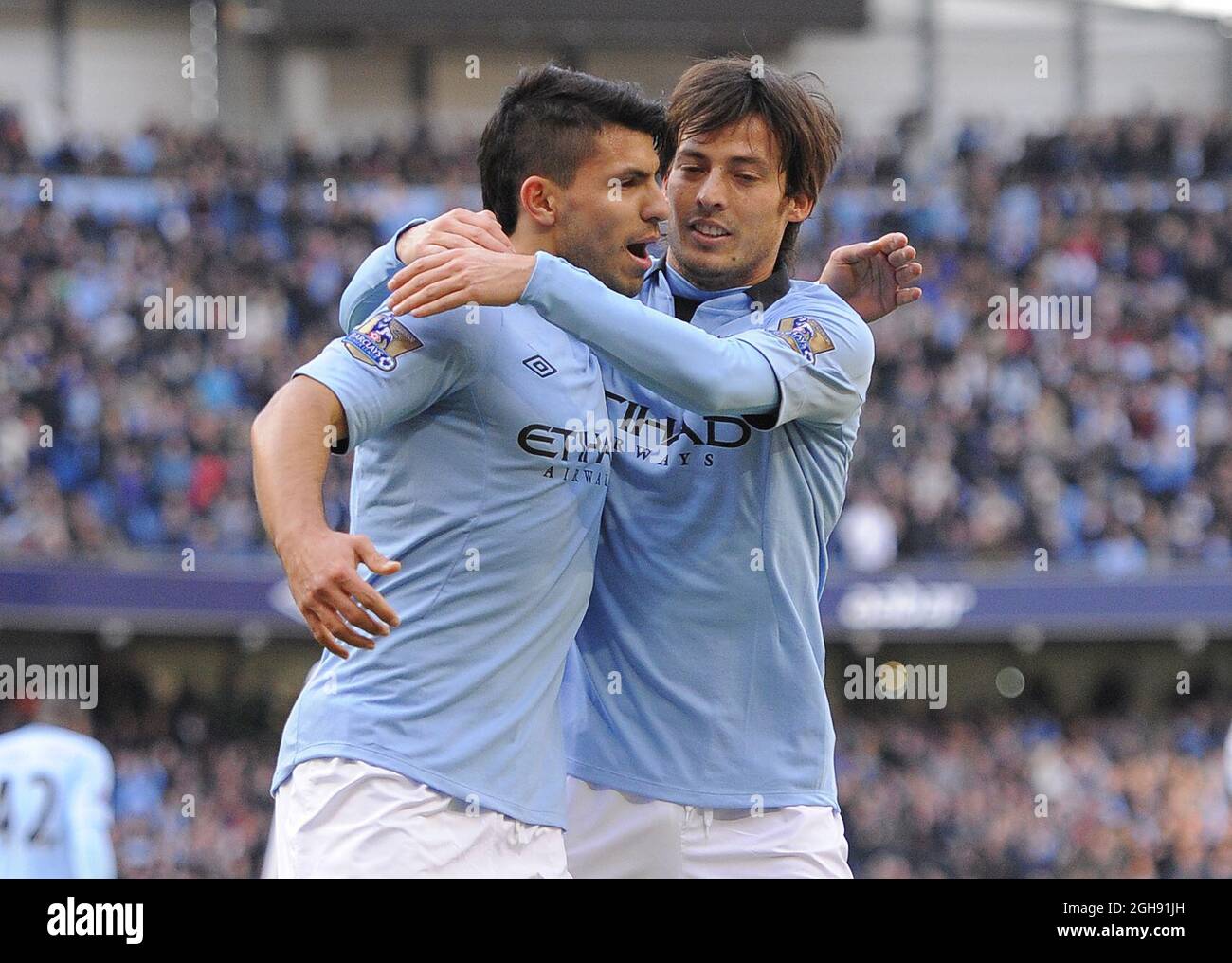 Sergio Aguero of Manchester City celebrates scoring the second goal with David Silva of Manchester City during the FA Cup, Fifth Round between Manchester City and Leeds United at the Etihad Stadium on February 17, 2013. Stock Photo
