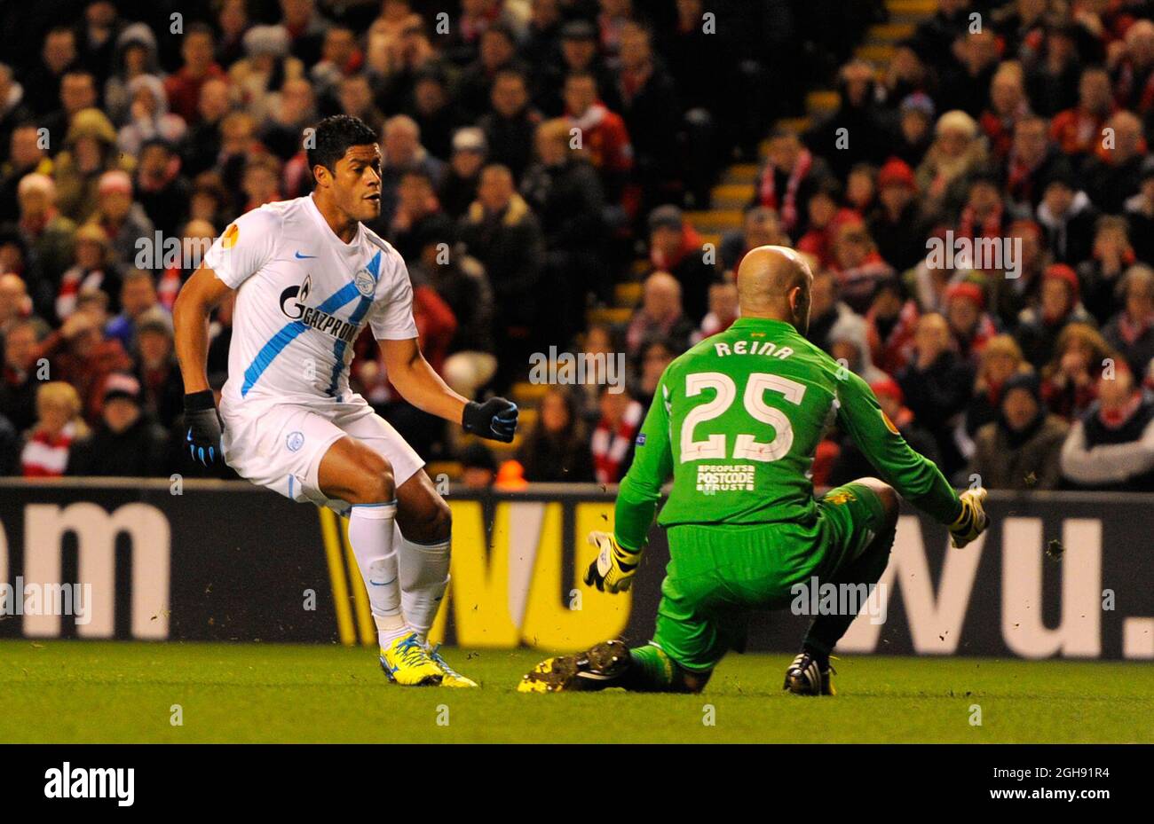 Hulk of Zenit St Petersburg scores past Jose Manuel Reina of Liverpool for the first goal during the UEFA Europa League Round of 32, Second Leg match between Liverpool and Zenit St Petersburg at the Anfield Stadium in Liverpool, United Kingdom on February 21, 2013. Stock Photo