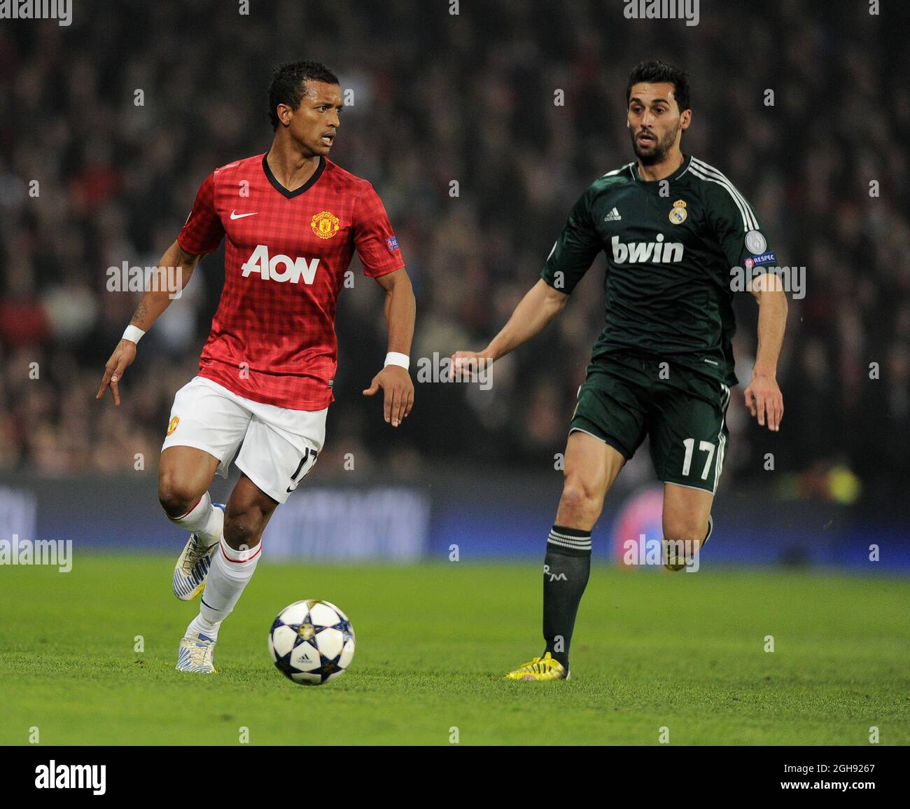 Nani of Manchester United tussles with Alvaro Arbeloa of Real Madrid during the UEFA Champions League round 16, match between Manchester United and Real Madrid at Old Trafford Stadium in Manchester, UK on March 5, 2013. Stock Photo
