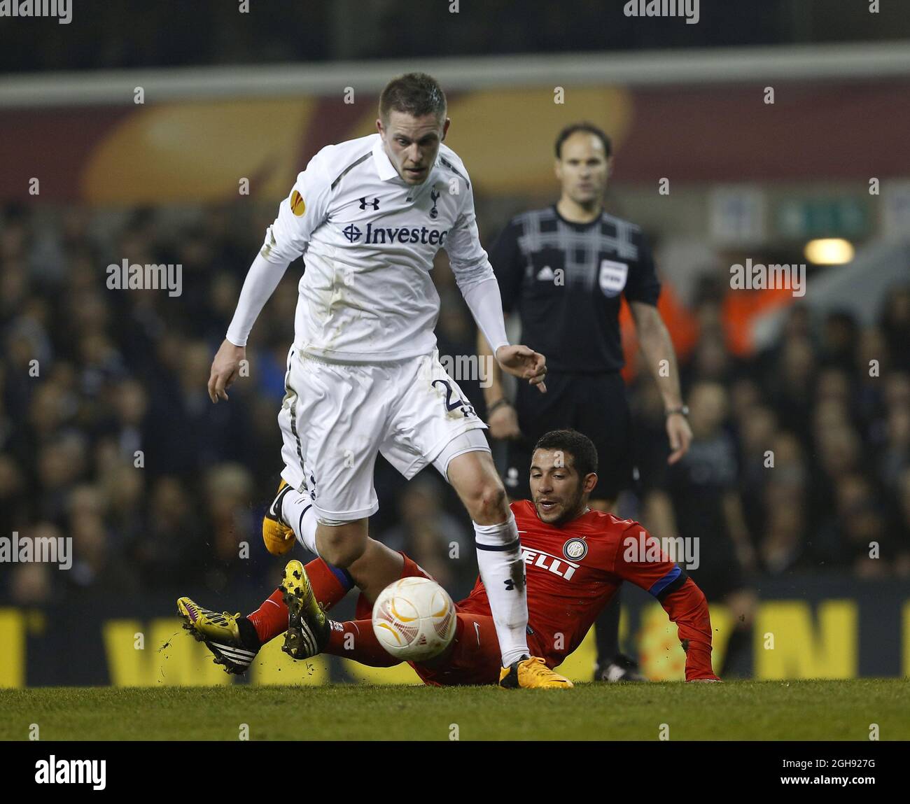 Tottenham's Gylfi Sigurdsson tussles with Inter's Walter Gargano during the UEFA Europa League round of 16 first leg soccer match between Tottenham Hotspur and Inter Milan at White Hart Lane in London, United Kingdom on Thursday, March 7, 2013. Stock Photo