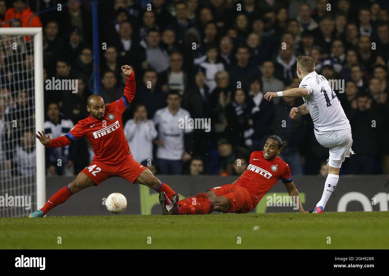 Tottenham's Lewis Holtby tussles with Inter's Jonathan and Alvaro Pereira during the UEFA Europa League round of 16 first leg soccer match between Tottenham Hotspur and Inter Milan at White Hart Lane in London, United Kingdom on Thursday, March 7, 2013. Stock Photo