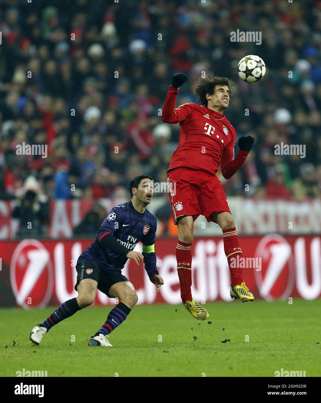 Munich's Javi Martinez tussles with Arsenal's Mikel Arteta during the Round of 16, Second Leg match between Bayern Munich and Arsenal at the Allianz Arena in Munich on March 13, 2013. Picture: David Klein Stock Photo