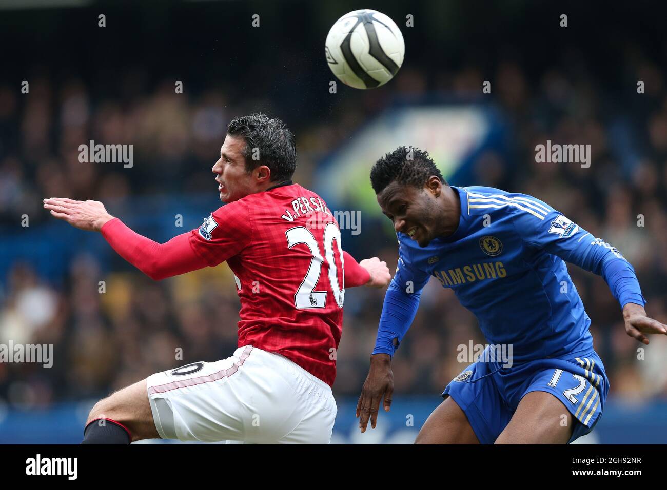 Manchester United's Robin van Persie and John Mikel Obi of Chelsea in action during the FA Cup Final Replay match between Chelsea and Manchester United at Stamford Bridge, London on April 1, 2013. Stock Photo