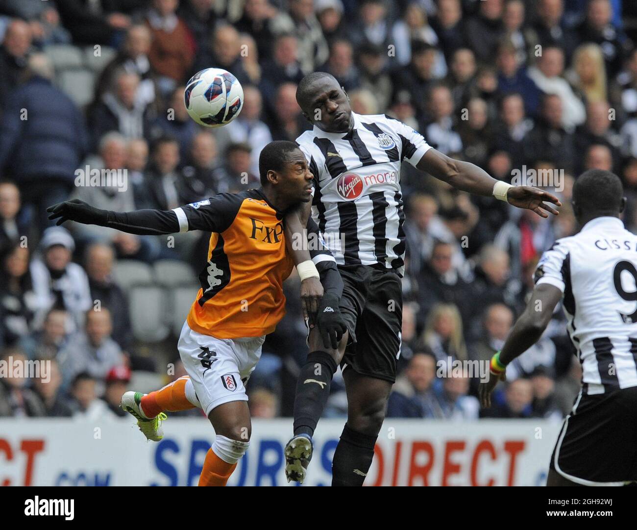Eyong Enoh of Fulham and Moussa Sissoko of Newcastle United during the Barclays Premier League match between Newcastle Utd and Fulham at St. James' Park in Newcastle on April 7th, 2013. Stock Photo