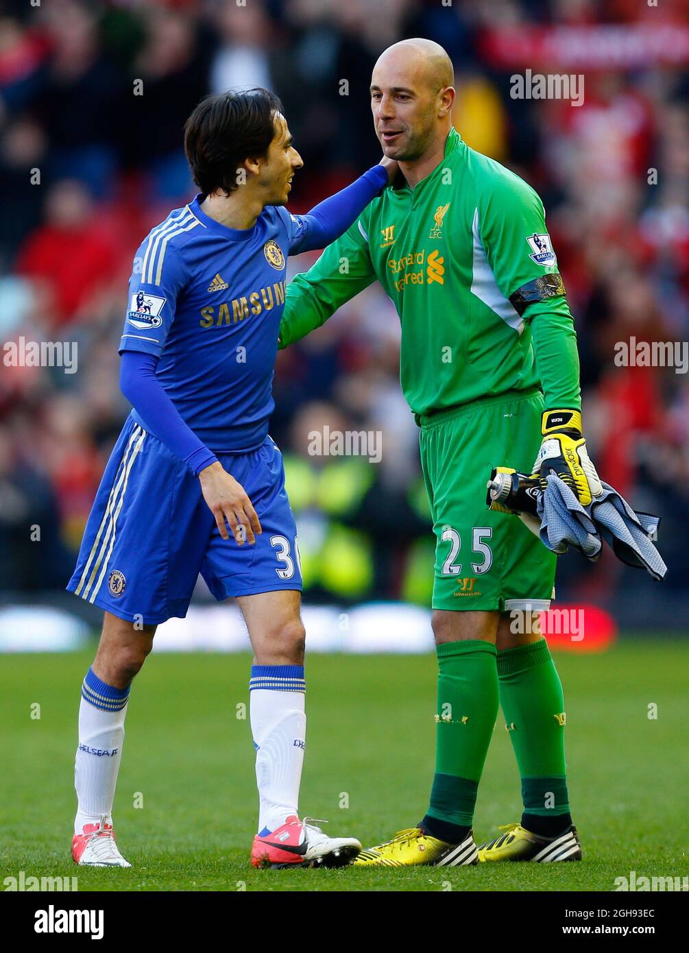 Pepe Reina of Liverpool and Yossi Benayoun of Chelsea talk at full time during the Barclays Premier League match between Liverpool and Chelsea in Anfield Stadium on April 21, 2013. Stock Photo
